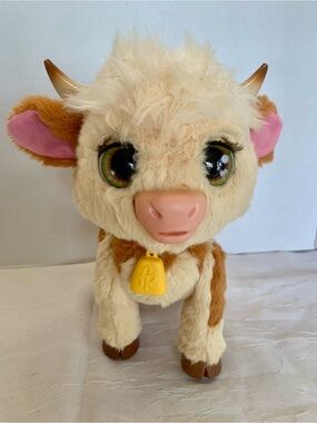 Fur Real “Maggie” the feed and follow cow.